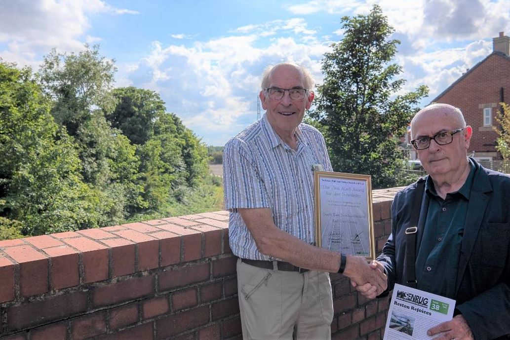 Railfuture NE Branch Chair presents SENRUG’s Dave Shaw with the Best Newsletter Award